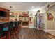 Spacious home bar area with a large beverage cooler and seating at 107 Estates At The Lake Dr, Canton, GA 30114