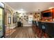 Home bar featuring a mini fridge, custom lighting, and an array of bar accessories at 107 Estates At The Lake Dr, Canton, GA 30114