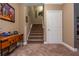 Finished basement featuring stairs, carpet, and a door to an adjoining room at 107 Estates At The Lake Dr, Canton, GA 30114