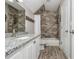 Well-lit bathroom featuring modern fixtures, granite countertops and tiled shower at 107 Estates At The Lake Dr, Canton, GA 30114