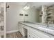 Stylish bathroom featuring granite countertops, undermount sink, and stone-look shower at 107 Estates At The Lake Dr, Canton, GA 30114
