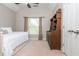 Cozy bedroom featuring a daybed, neutral walls, and a matching wooden desk and bookcase at 107 Estates At The Lake Dr, Canton, GA 30114