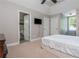 Inviting bedroom featuring a television and ensuite bath for comfort and privacy at 107 Estates At The Lake Dr, Canton, GA 30114
