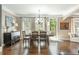 Inviting dining area with wood floors, large windows, and access to the outdoor deck at 107 Estates At The Lake Dr, Canton, GA 30114