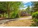 Brick two-story home with long driveway and lush landscaping at 107 Estates At The Lake Dr, Canton, GA 30114