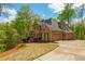 Brick two-story home with attached garage and front lawn at 107 Estates At The Lake Dr, Canton, GA 30114