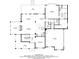 Open first floor with a sunroom, living room, dining area, kitchen, pantry, and access to a deck and garage at 107 Estates At The Lake Dr, Canton, GA 30114