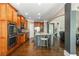 Open kitchen concept with wood floors, stainless steel appliances, granite counters, and island with seating at 107 Estates At The Lake Dr, Canton, GA 30114