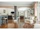 Open concept living room features hardwood floors, a dining area, and ample natural light at 107 Estates At The Lake Dr, Canton, GA 30114