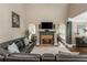 Spacious living room with fireplace, TV, leather seating and beautiful archways at 107 Estates At The Lake Dr, Canton, GA 30114