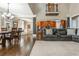 Open concept living area with dining table and kitchen in the background at 107 Estates At The Lake Dr, Canton, GA 30114