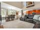 Bright and airy living space with a leather sectional, dining area, and kitchen at 107 Estates At The Lake Dr, Canton, GA 30114