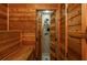 Cedar sauna with view into tile shower area at 107 Estates At The Lake Dr, Canton, GA 30114