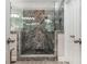 Luxurious walk-in shower boasts decorative tile, dual shower heads, and glass enclosure at 107 Estates At The Lake Dr, Canton, GA 30114