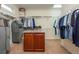 Spacious walk-in closet with custom shelving, an island, and plenty of hanging space at 107 Estates At The Lake Dr, Canton, GA 30114