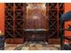Custom wine cellar with wood wine racks and unique tile flooring at 107 Estates At The Lake Dr, Canton, GA 30114