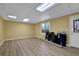 Finished basement features tile floors, drop ceiling and walkout door at 2433 Idlewood Way, Snellville, GA 30078