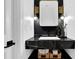 Powder room featuring black floating vanity, marble countertop, and gold accents at 2433 Idlewood Way, Snellville, GA 30078