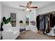 This bedroom offers a quiet sitting area and organized closet space at 2433 Idlewood Way, Snellville, GA 30078