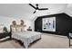 This cozy bedroom features neutral tones and a ceiling fan at 2433 Idlewood Way, Snellville, GA 30078