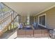 Covered outdoor patio with wicker seating and grill at 2433 Idlewood Way, Snellville, GA 30078
