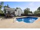 Large in-ground swimming pool with deck and fenced yard at 3457 Skyview Dr, Lithia Springs, GA 30122