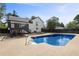 Large in-ground swimming pool with deck and fenced yard at 3457 Skyview Dr, Lithia Springs, GA 30122
