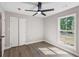 Bedroom with light gray walls, wood-look floors, and a ceiling fan at 3457 Skyview Dr, Lithia Springs, GA 30122