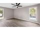 Bedroom featuring large windows, light paint, and wood-look flooring at 3457 Skyview Dr, Lithia Springs, GA 30122