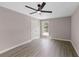 A bright bedroom features hardwood floors and a modern ceiling fan at 3457 Skyview Dr, Lithia Springs, GA 30122
