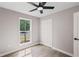 Bedroom with a view from the window, ceiling fan, light gray paint, and wood-look flooring at 3457 Skyview Dr, Lithia Springs, GA 30122