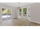 Bright dining area with large windows and a sliding glass door to the deck at 3457 Skyview Dr, Lithia Springs, GA 30122