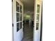 Inviting entryway with white paneled front door and view of open-concept kitchen and dining area at 3457 Skyview Dr, Lithia Springs, GA 30122