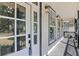 Inviting front porch with black trim, white columns, and a view of the surrounding neighborhood at 3457 Skyview Dr, Lithia Springs, GA 30122