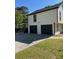 Spacious two-car garage with black doors and a paved driveway, providing ample parking at 3457 Skyview Dr, Lithia Springs, GA 30122
