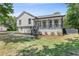 Charming two-story home with a covered front porch and well-maintained lawn at 3457 Skyview Dr, Lithia Springs, GA 30122