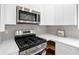 Kitchen with stainless steel appliances, gas range, and white countertops at 3457 Skyview Dr, Lithia Springs, GA 30122