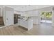 Modern kitchen featuring an island, stainless steel appliances, and a sliding glass door to the deck at 3457 Skyview Dr, Lithia Springs, GA 30122