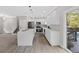 Modern kitchen featuring an island, stainless steel appliances, and a view of the backyard at 3457 Skyview Dr, Lithia Springs, GA 30122