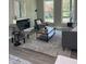 Comfortable living room with plush seating, large windows, and an electric fireplace, perfect for relaxing at 3457 Skyview Dr, Lithia Springs, GA 30122
