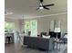 Cozy living room with a fireplace, comfortable seating, natural light, and open to the dining area at 3457 Skyview Dr, Lithia Springs, GA 30122