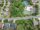 A neighborhood aerial view featuring mature trees, amenities, and well-maintained homes at 4965 Skyland Pkwy, Cumming, GA 30028