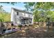 Large backyard with a screened porch, fenced yard, and an outdoor dining area, ideal for Gathering gatherings at 4965 Skyland Pkwy, Cumming, GA 30028