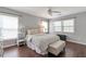 Bright bedroom featuring neutral tones, multiple windows, and a comfortable upholstered bed at 4965 Skyland Pkwy, Cumming, GA 30028