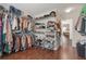 A spacious walk-in closet features shelving and hanging racks for maximum storage and organization at 4965 Skyland Pkwy, Cumming, GA 30028