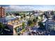 Rendering of a lively commercial area with diverse storefronts, restaurants, and outdoor dining at 4965 Skyland Pkwy, Cumming, GA 30028