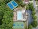 Aerial shot of community pool, tennis court, basketball court, parking, and clubhouse at 4965 Skyland Pkwy, Cumming, GA 30028