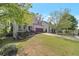 Well-maintained home with a beautifully landscaped front yard and an attached two-car garage at 4965 Skyland Pkwy, Cumming, GA 30028