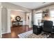 Comfortable home office with hardwood floors, neutral walls, and ample natural light, ideal for productivity at 4965 Skyland Pkwy, Cumming, GA 30028