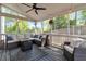 Inviting screened-in porch with comfortable seating and outdoor ceiling fan at 4965 Skyland Pkwy, Cumming, GA 30028